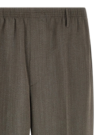 Trousers by CELLAR DOOR for men in virgin wool brown features a tailored silhouette with a tailored tapered-leg & wide, defined by its long and a sophisticated .