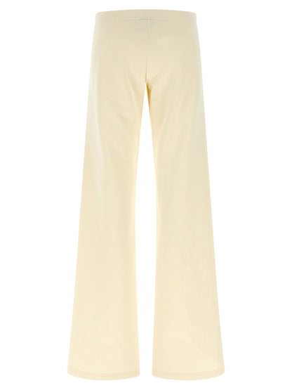 Joggers by Balenciaga for women in cotton white features a refined silhouette with a refined flared & wide, defined by a low rise and a refined long for a refined finish.