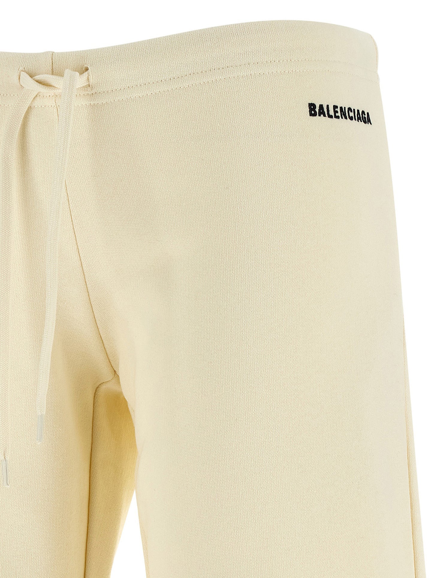 Joggers by Balenciaga for women in cotton white features a polished silhouette with a polished flared & wide, reaching a polished long and finished with a polished low rise.