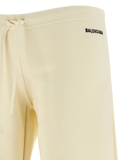 Joggers by Balenciaga for women in cotton white features a polished silhouette with a polished flared & wide, reaching a polished long and finished with a polished low rise.