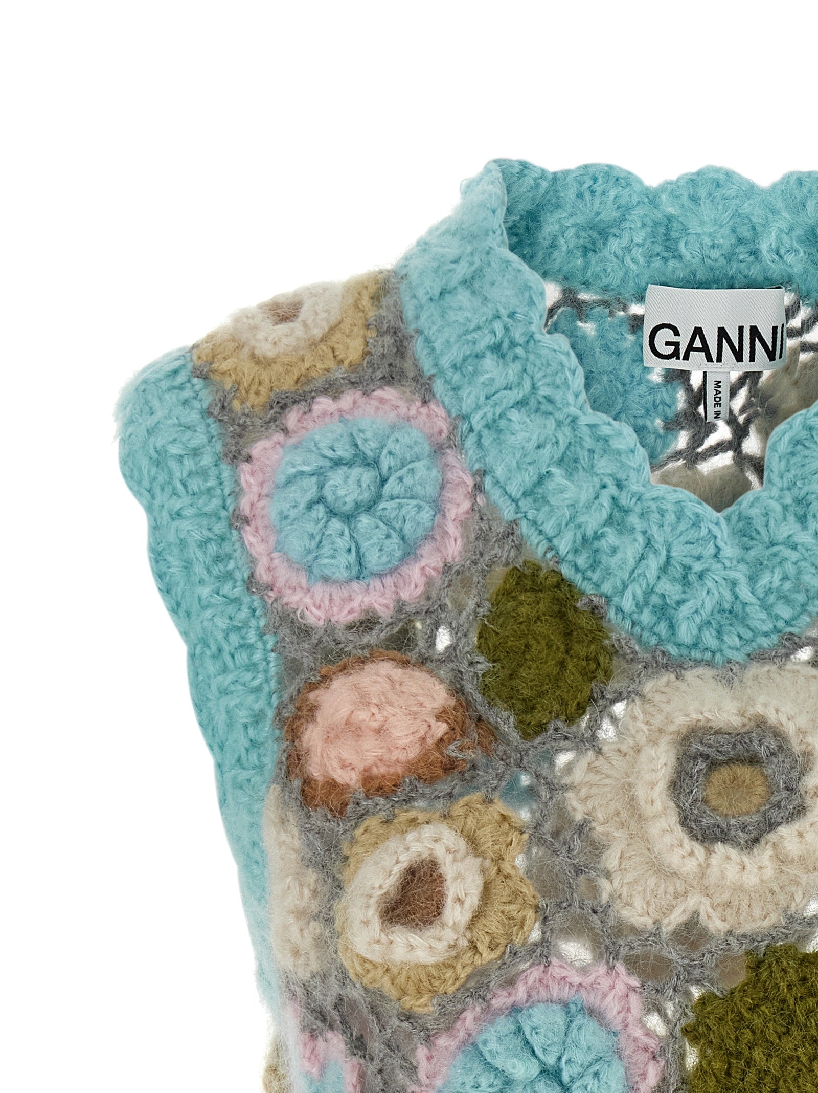 Vest by Ganni for women in mohair wool & polyamide multicolor, patterned & floral showcases a dynamic silhouette, perfectly balancing with a dynamic v-neck neckline for a sophisticated, high-fashion look.