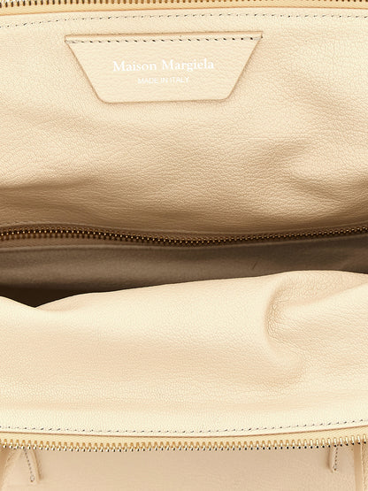 This East West Handbag by Maison Margiela for women in viscose goat leather & fur and multicolor, pink & signature presents a sculptural silhouette featuring a secure zipper, ample , and versatile shoulder-strap, adjustable-strap & handle for a sculptural finish.