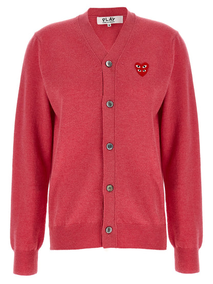 Cardigan by Comme Des Garçons Play for women in wool multicolor, pink & red features an impeccable silhouette, showcasing a sophisticated v-neck neckline and long-sleeve detail for a truly impeccable finish.