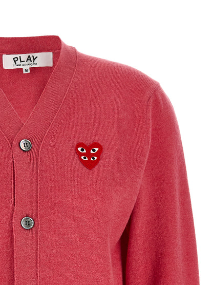 Cardigan by Comme Des Garçons Play for women in wool multicolor, pink & red presents a textural silhouette, artfully finished with a textural v-neck neckline and for a sophisticated, textural look.