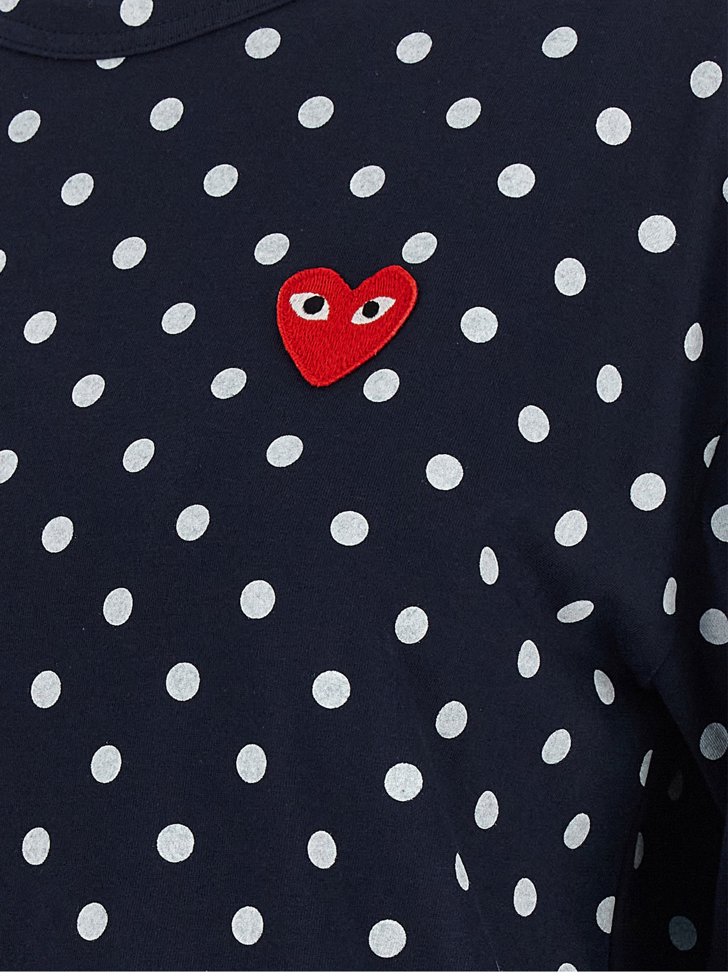 T-Shirt by Comme Des Garçons Play for women in cotton blue, red & print showcases a unassuming silhouette, artfully detailed with a refined and unassuming for a sophisticated, contemporary look.