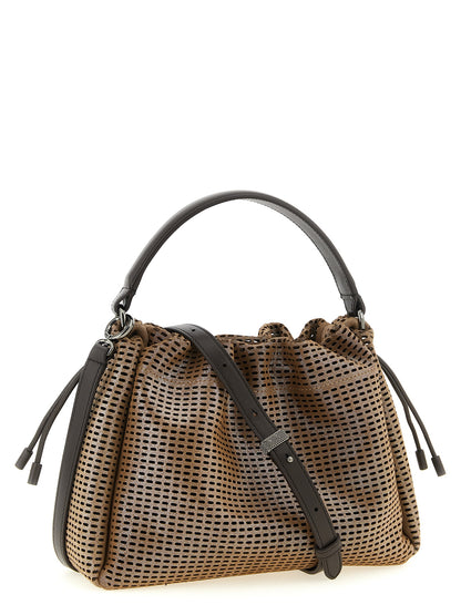 This Quilted Bucket Handbag by Brunello Cucinelli for women in calfskin leather and brown presents a sculptural silhouette featuring a secure drawstring & magnetic, ample , and versatile shoulder-strap, handle & adjustable-strap for a sculptural finish.