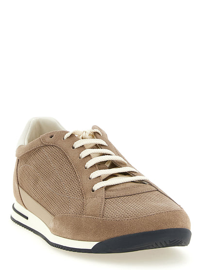 Sneakers by Brunello Cucinelli for men in bos taurus suede calfskin leather beige presents a impeccable silhouette as Men's Low Top Bos Taurus Suede Calfskin Leather Sneakers, expertly defined by a impeccable low-top style for a impeccable, high-fashion look.