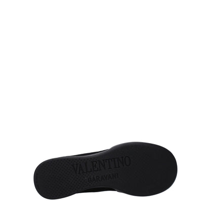 Sneakers by Valentino Garavani for men in rubber & fabric black presents a sumptuous silhouette, artfully capturing the essence of the Men's High Top Rubber & Fabric Sneakers with its sumptuous high-top style design.