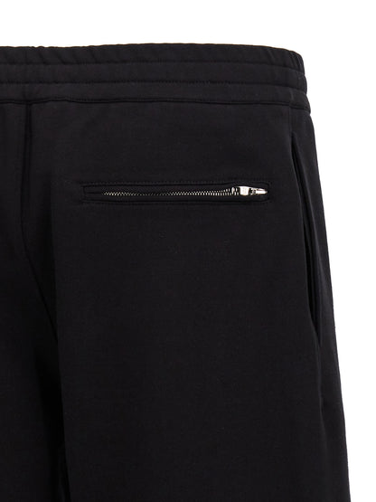 Bermuda Shorts by Alexander McQueen for men in cotton black & print presents a sleek silhouette, featuring a sleek with a refined short and a sophisticated .