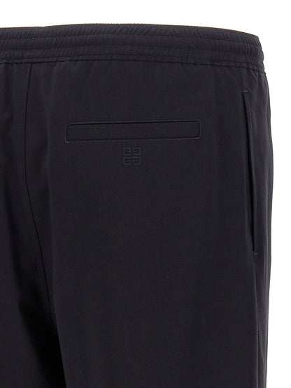 Bermuda Shorts by Givenchy for men in polyamide & wool blue features an tailored silhouette, showcasing a tailored with a short and for a sophisticated look.