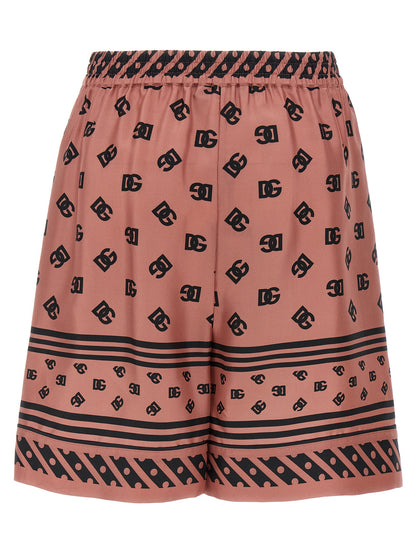 Bermuda Shorts by Dolce & Gabbana for women in silk satin multicolor & pink features a sartorial silhouette, showcasing a sartorial and short with a sophisticated for a sartorial look.