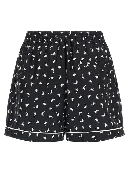 Cargo Shorts by Moschino for women in silk twill bicolour, black, white & print features a utilitarian chic silhouette, meticulously detailed with a utilitarian chic , short, and for a premium, utilitarian look.
