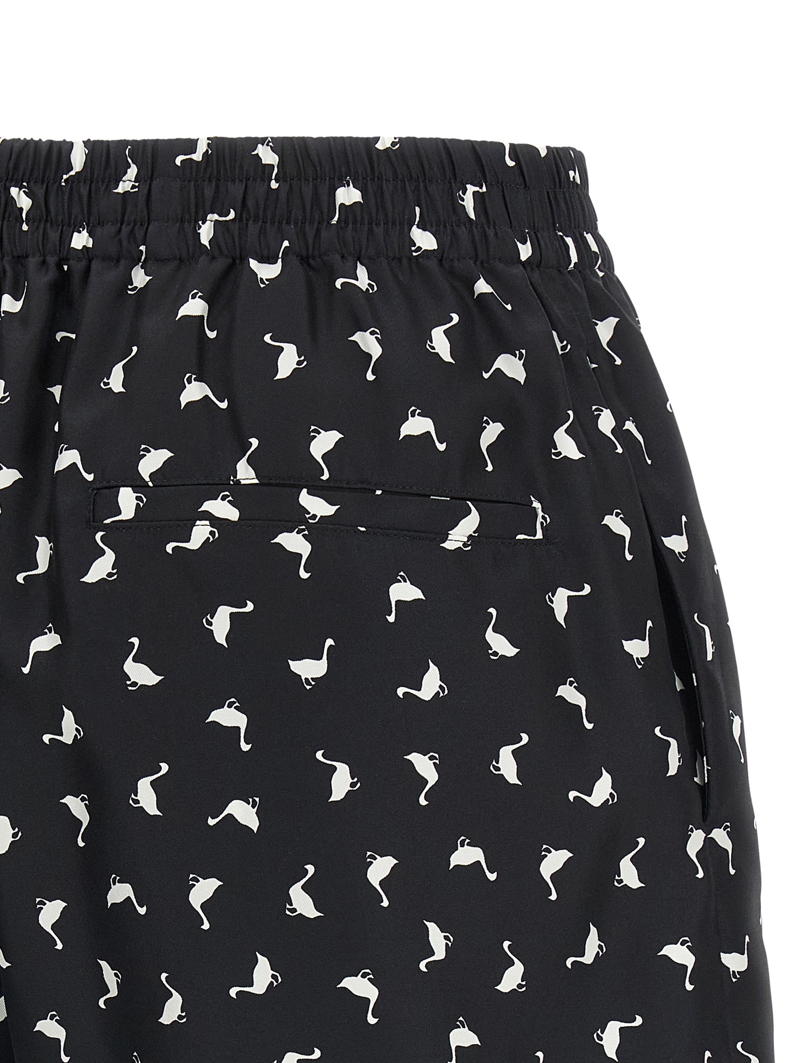 Cargo Shorts by Moschino for women in silk twill bicolour, black, white & print features an utilitarian design, highlighting a utilitarian and short cut with a comfortable for a sophisticated, premium look.