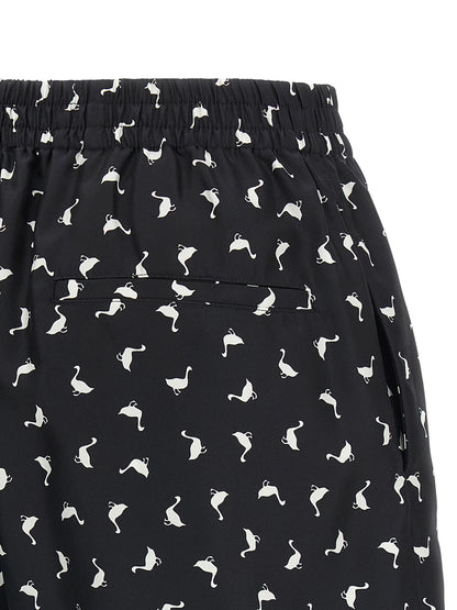 Cargo Shorts by Moschino for women in silk twill bicolour, black, white & print features an utilitarian design, highlighting a utilitarian and short cut with a comfortable for a sophisticated, premium look.