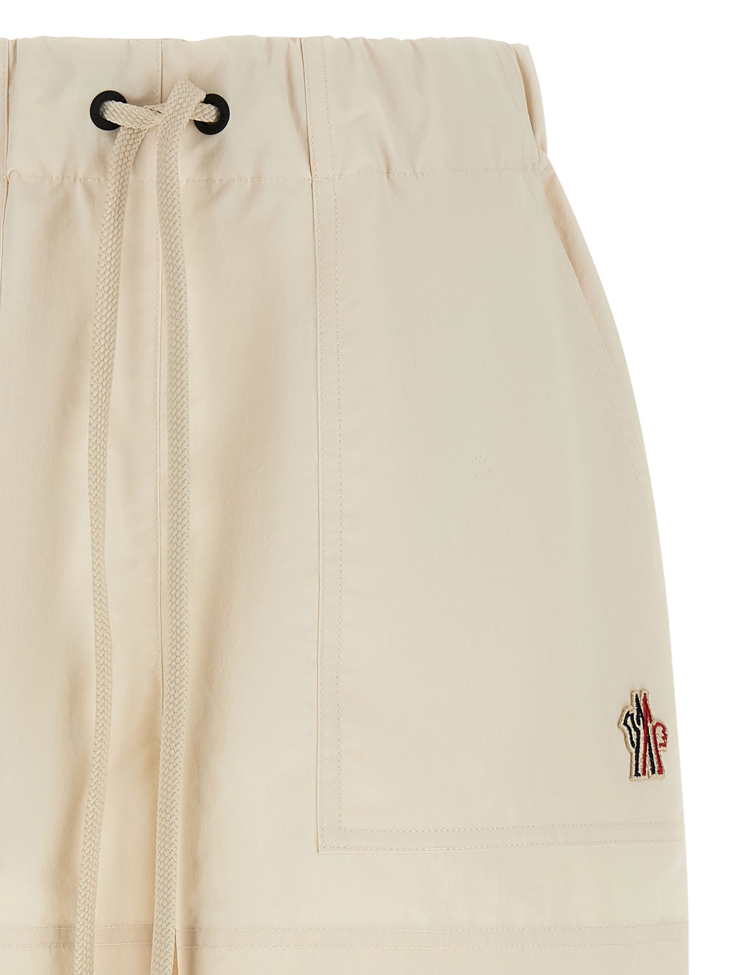 Bermuda Shorts by Moncler Grenoble for women in polyester white presents a sleek silhouette, featuring a sleek with a refined short and a sophisticated .