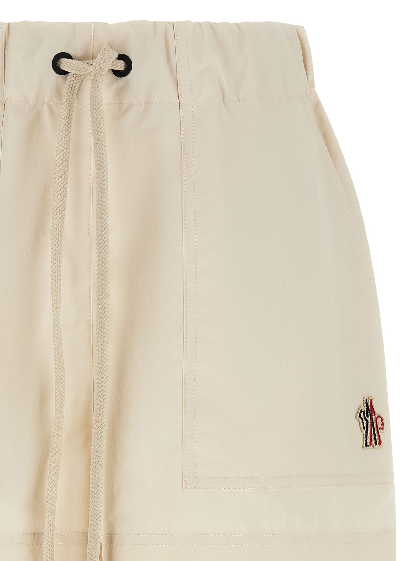 Bermuda Shorts by Moncler Grenoble for women in polyester white presents a sleek silhouette, featuring a sleek with a refined short and a sophisticated .