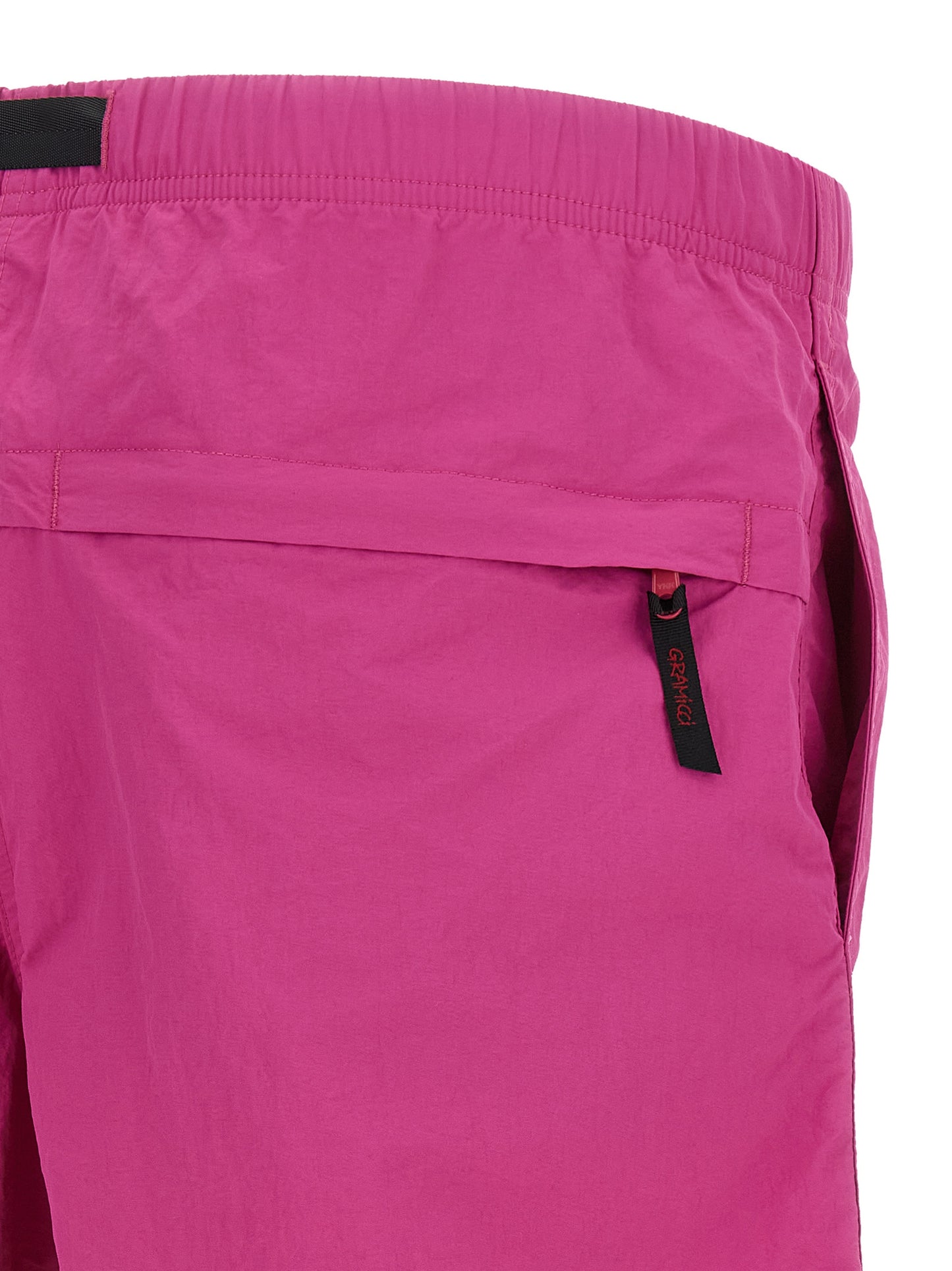 Bermuda Shorts by Gramicci for men in nylon fuchsia features an tailored silhouette, showcasing a tailored with a short and for a sophisticated look.