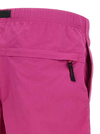 Bermuda Shorts by Gramicci for men in nylon fuchsia features an tailored silhouette, showcasing a tailored with a short and for a sophisticated look.