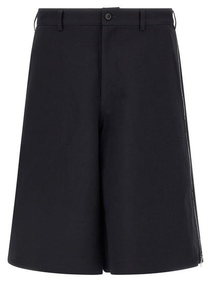 Bermuda Shorts by Comme Des Garçons for men in polyester blue & herringbone features a sartorial silhouette, showcasing a sartorial wide and short with a sophisticated for a sartorial look.
