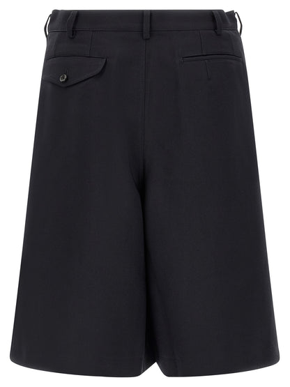 Bermuda Shorts by Comme Des Garçons for men in polyester blue & herringbone features an tailored silhouette, showcasing a tailored wide with a short and for a sophisticated look.