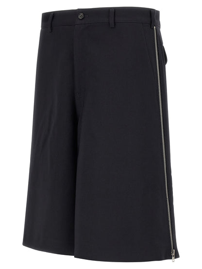 Bermuda Shorts by Comme Des Garçons for men in polyester blue & herringbone presents a sleek silhouette, featuring a sleek wide with a refined short and a sophisticated .