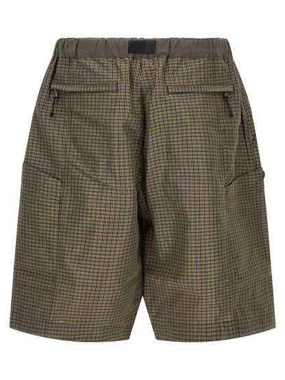 Bermuda Shorts by Comme Des Garçons for men in linen & polyester bicolour, green & patterned features a sartorial silhouette, showcasing a sartorial wide and short with a sophisticated for a sartorial look.
