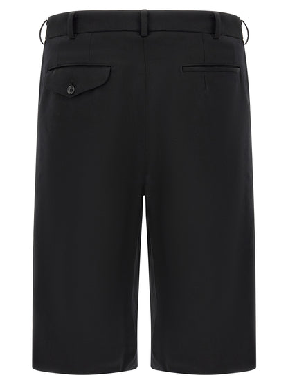 Bermuda Shorts by Comme Des Garçons for men in wool black features an tailored silhouette, showcasing a tailored straight-leg, flared & wide with a short and for a sophisticated look.