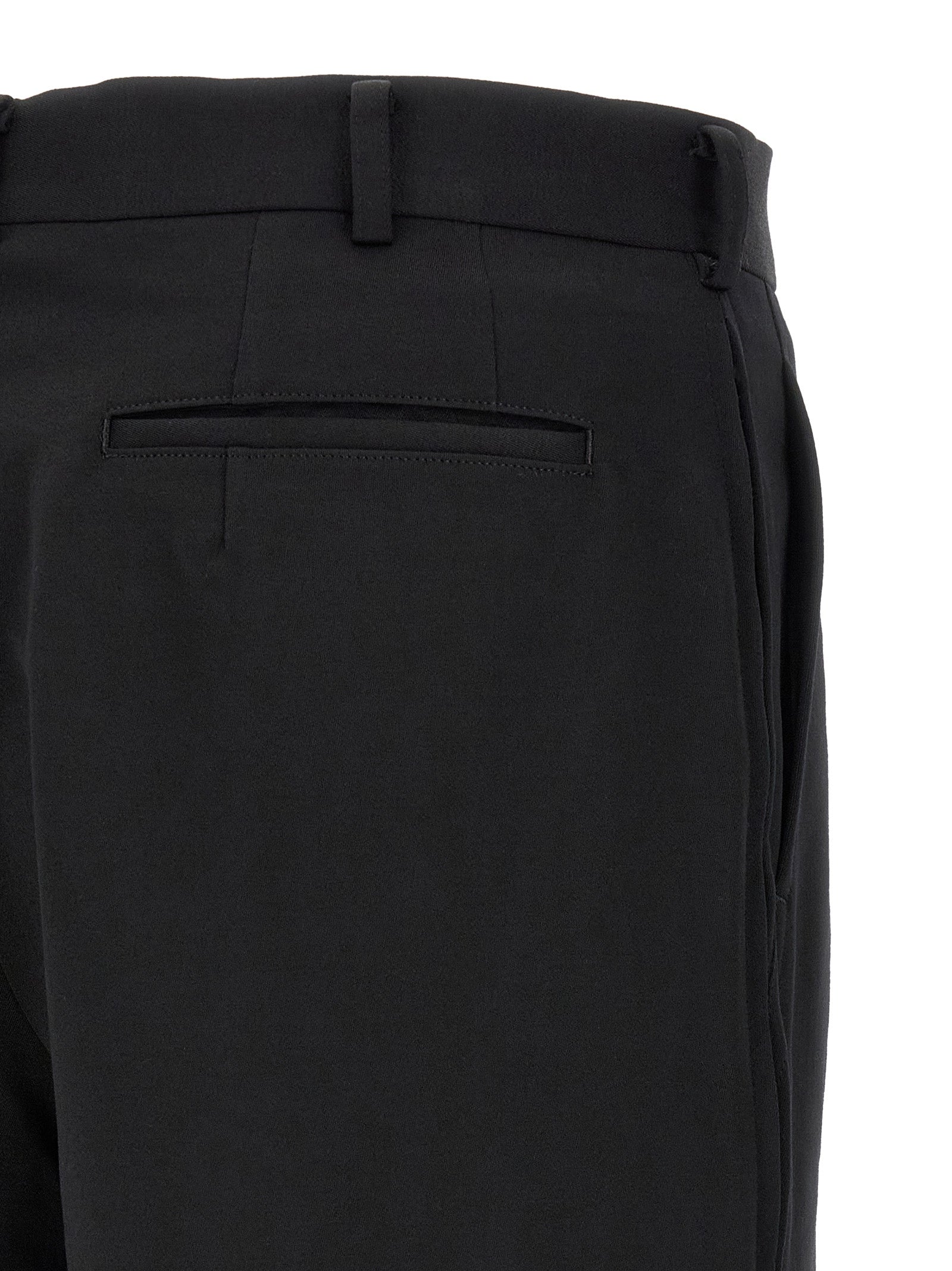 Bermuda Shorts by Comme Des Garçons for men in wool black presents a sleek silhouette, featuring a sleek straight-leg, flared & wide with a refined short and a sophisticated .