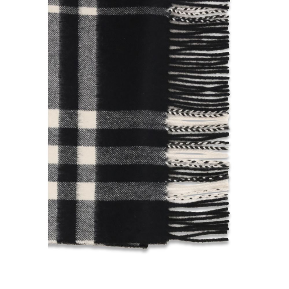 Scarf by Burberry for women in cashmere & capra leather black features a snug silhouette, perfectly showcasing the elegant drape and premium finish of the Cashmere & Capra Leather Fringes Scarf.