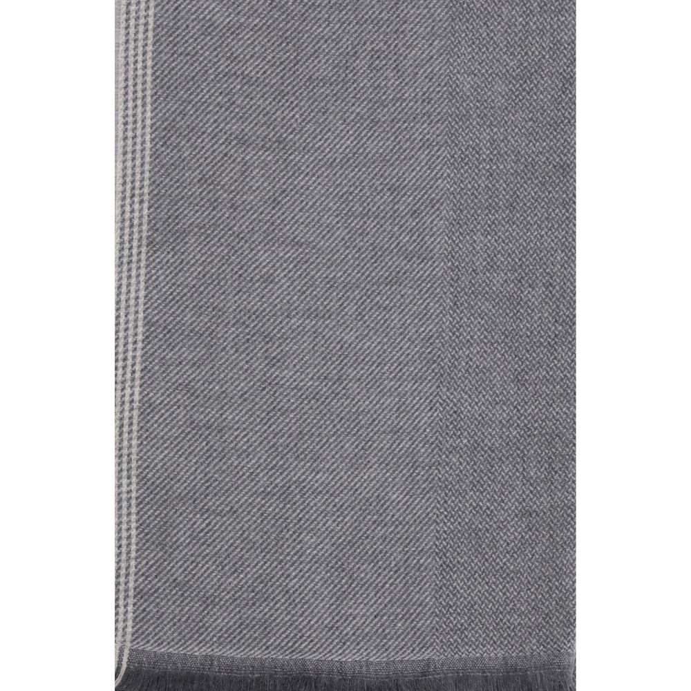 Scarf by Brunello Cucinelli for men in cashmere gray & patterned showcases a warm silhouette from the Cashmere Wrap Frayed-Edge Scarf collection, offering a warm drape that exudes sophisticated luxury.