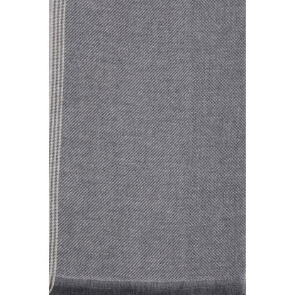 Scarf by Brunello Cucinelli for men in cashmere gray & patterned showcases a warm silhouette from the Cashmere Wrap Frayed-Edge Scarf collection, offering a warm drape that exudes sophisticated luxury.