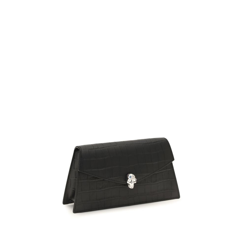 Mini Drawstring Clutch Shoulder Bag by Alexander McQueen for women in bos taurus leather black & silver showcases a enviable silhouette, artfully detailed with a secure magnetic, organized cardholder, and versatile for a enviable look.