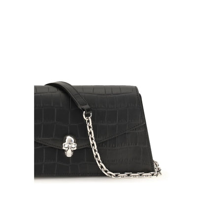 Mini Drawstring Clutch Shoulder Bag by Alexander McQueen for women in bos taurus leather black & silver features an effortlessly chic silhouette with a secure magnetic, ample cardholder, and versatile for effortlessly chic everyday luxury.