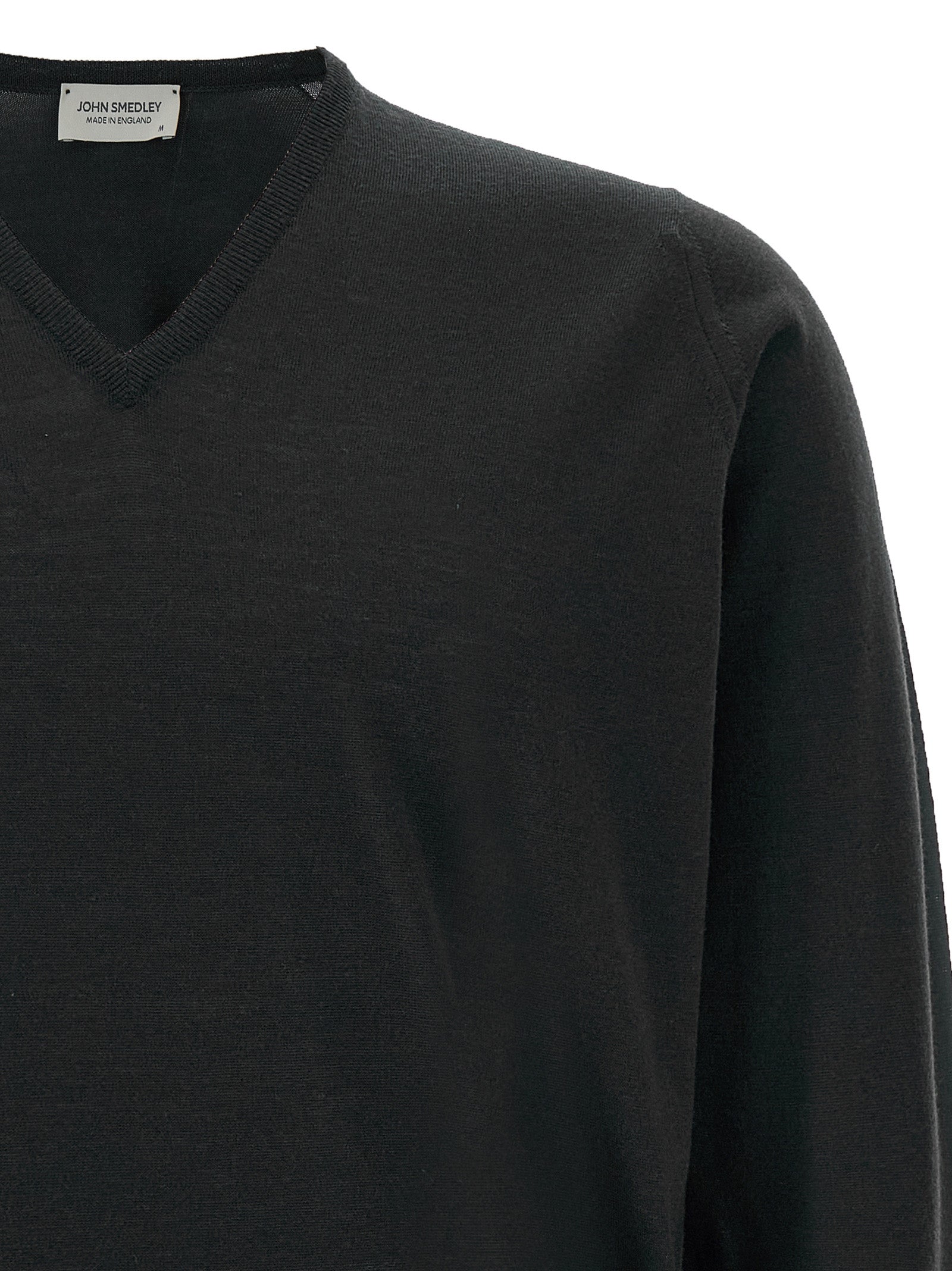 Cardigan by JOHN SMEDLEY for men in merino wool black features a dramatic silhouette, showcasing a sophisticated v-neck neckline and dramatic detail for a timeless, premium look.