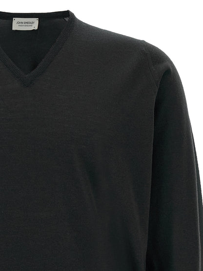 Cardigan by JOHN SMEDLEY for men in merino wool black features a dramatic silhouette, showcasing a sophisticated v-neck neckline and dramatic detail for a timeless, premium look.