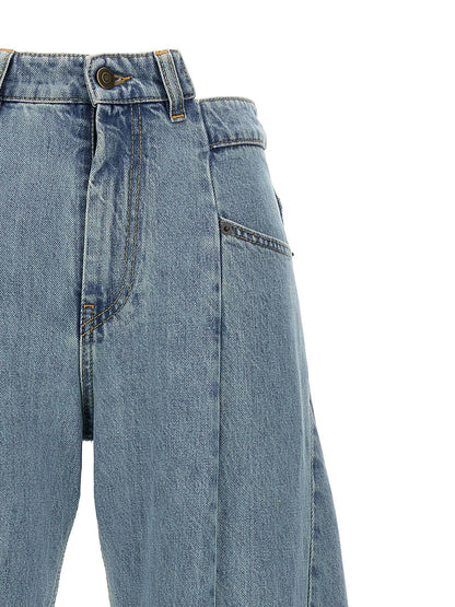 Jeans by Maison Margiela for women in denim cotton light-blue presents a tailored silhouette, showcasing a tailored wide and long cut with a refined for a truly tailored aesthetic.