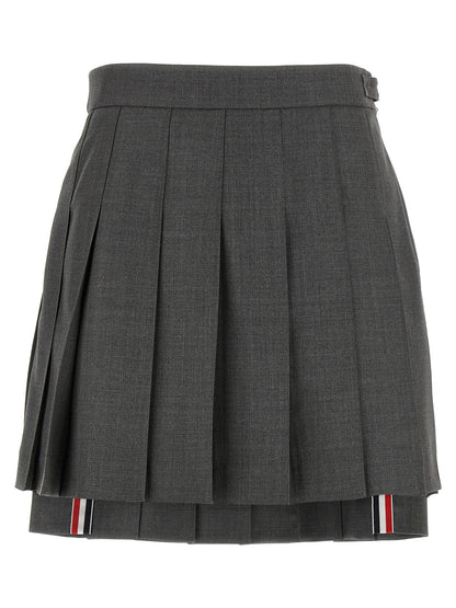 Skirt by Thom Browne for women in wool gray & signature features a captivating silhouette, showcasing the captivating Waves Women's Pleated Wool Long Skirt design with a sophisticated long for a captivating look.