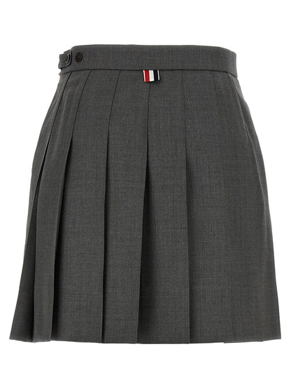 Skirt by Thom Browne for women in wool gray & signature showcases a sultry silhouette, elegantly defined by its long and the sophisticated sultry design of the Waves Women's Pleated Wool Long Skirt.