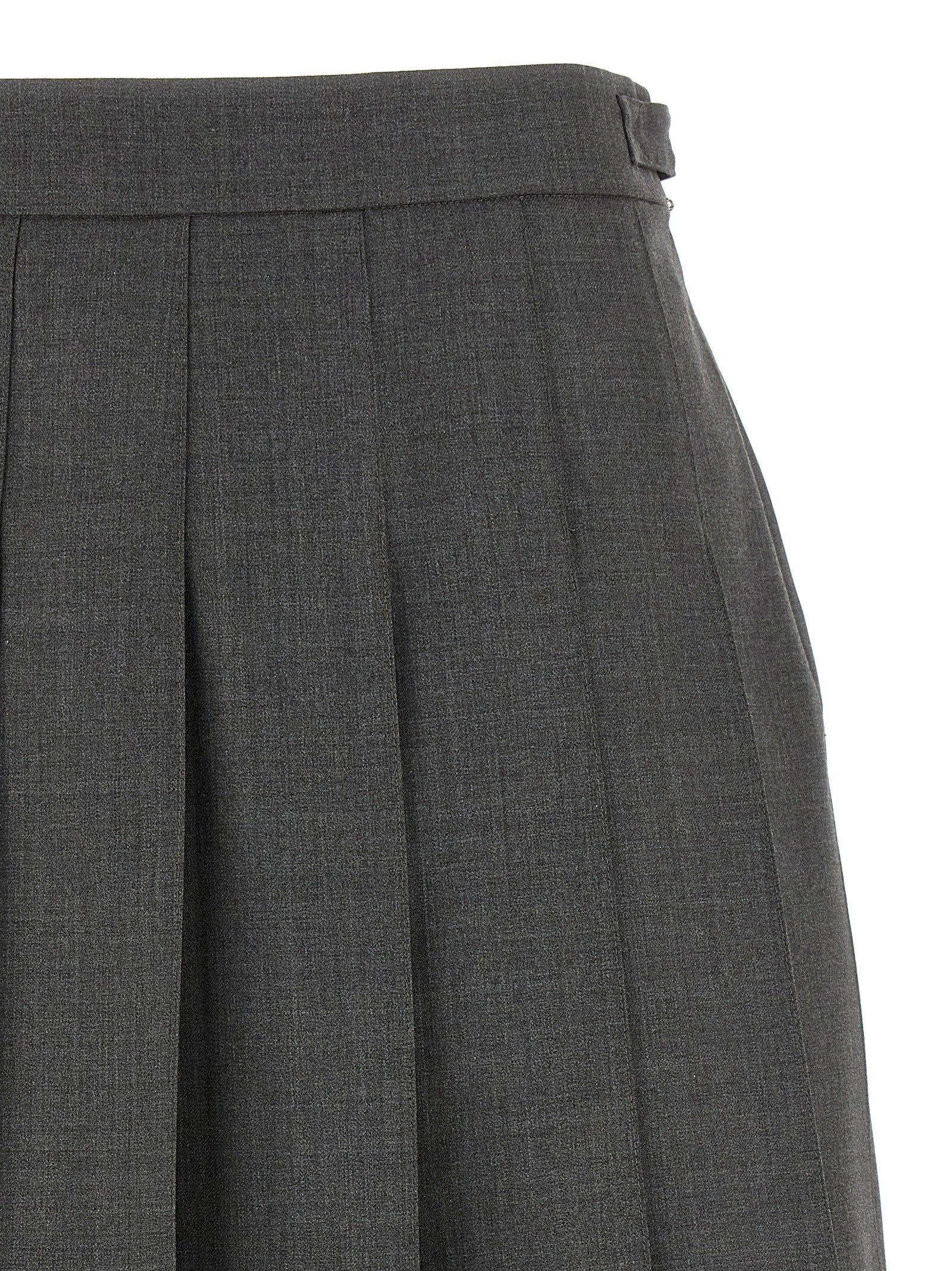 Skirt by Thom Browne for women in wool gray & signature showcases a dramatic silhouette, artfully capturing the essence of the Waves Women's Pleated Wool Long Skirt in a dramatic long cut for a refined look.