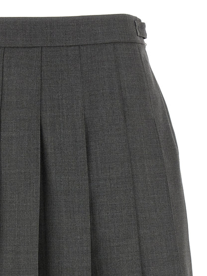 Skirt by Thom Browne for women in wool gray & signature showcases a dramatic silhouette, artfully capturing the essence of the Waves Women's Pleated Wool Long Skirt in a dramatic long cut for a refined look.