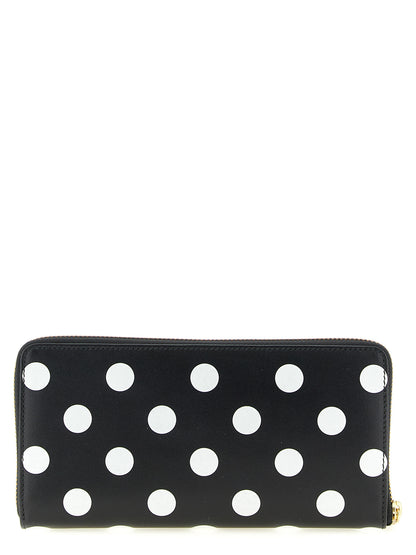 Wallet by Comme Des Garçons for men in calfskin leather bicolour, black, white, dots & print showcases a discerning silhouette, artfully capturing the essence of Calfskin Leather Wallet with its functional .