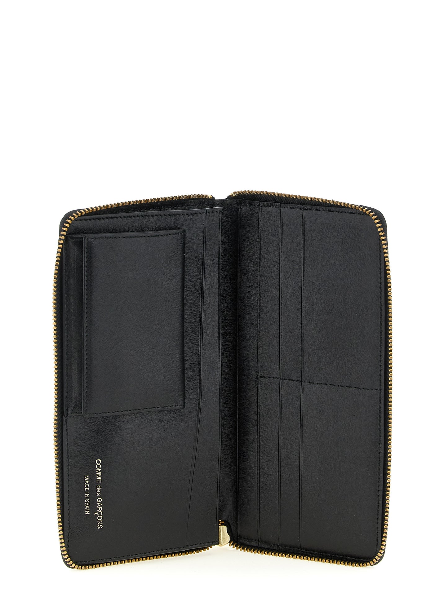 Wallet by Comme Des Garçons for men in calfskin leather bicolour, black, white, dots & print presents a architectural silhouette from the Calfskin Leather Wallet collection, showcasing architectural for a architectural finish.