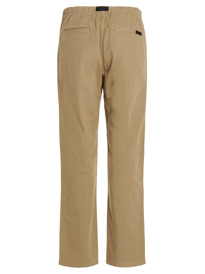 Trousers by Gramicci for men in cotton beige & print features a tailored silhouette with a tailored , defined by its long and a sophisticated .