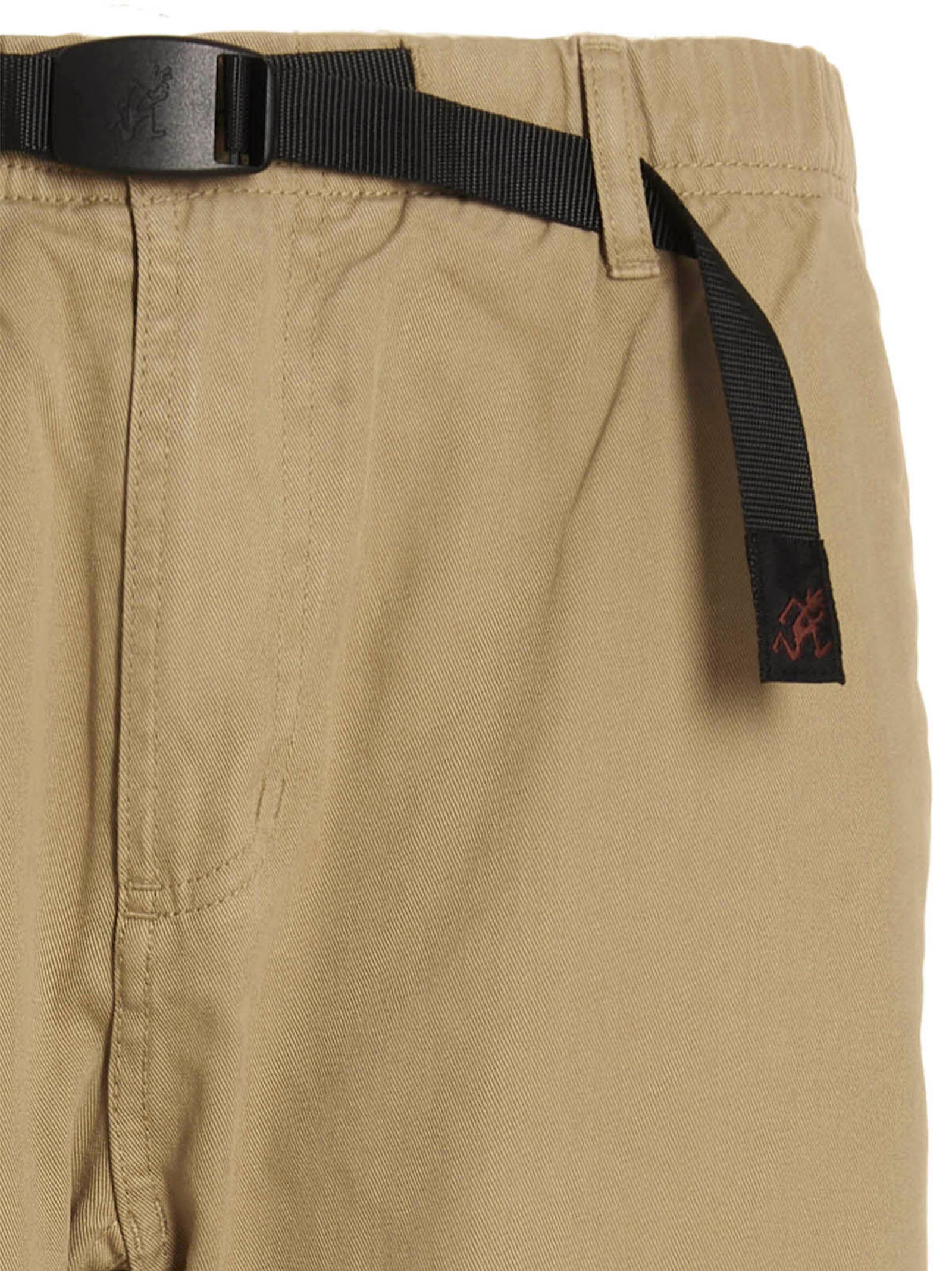 Trousers by Gramicci for men in cotton beige & print features a artisanal silhouette, showcasing a sophisticated with a long and for a artisanal finish.