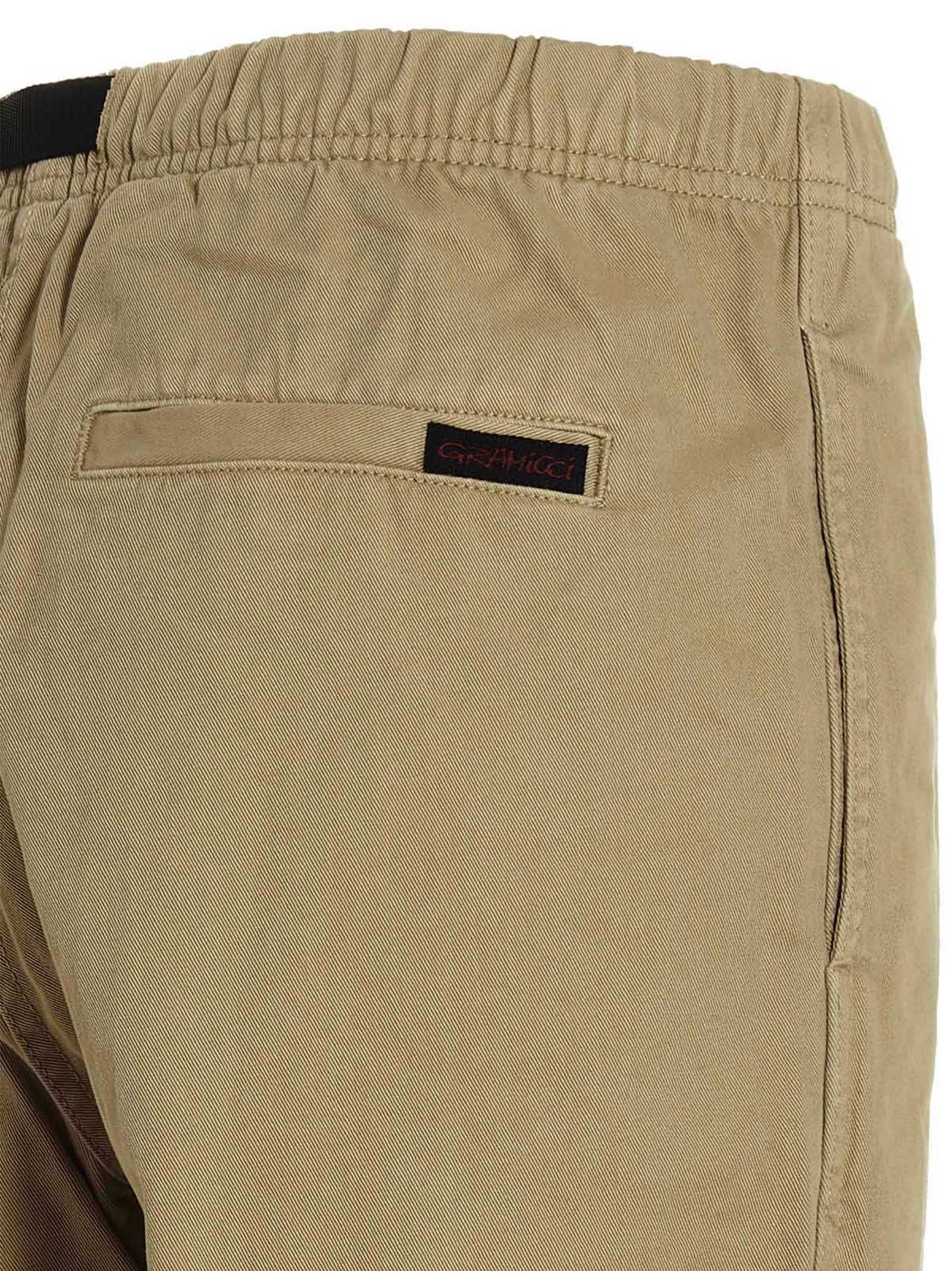 Trousers by Gramicci for men in cotton beige & print features a artisanal silhouette, showcasing a sophisticated with a long and for a artisanal finish.