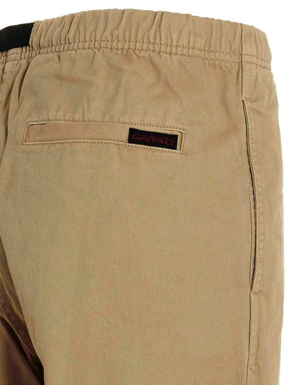 Trousers by Gramicci for men in cotton beige & print features a artisanal silhouette, showcasing a sophisticated with a long and for a artisanal finish.