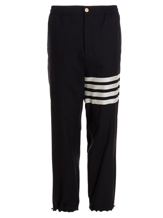 Trousers by Thom Browne for men in wool blue presents a perennial silhouette, meticulously tailored with a athletic cut, long finish, and an elegant .