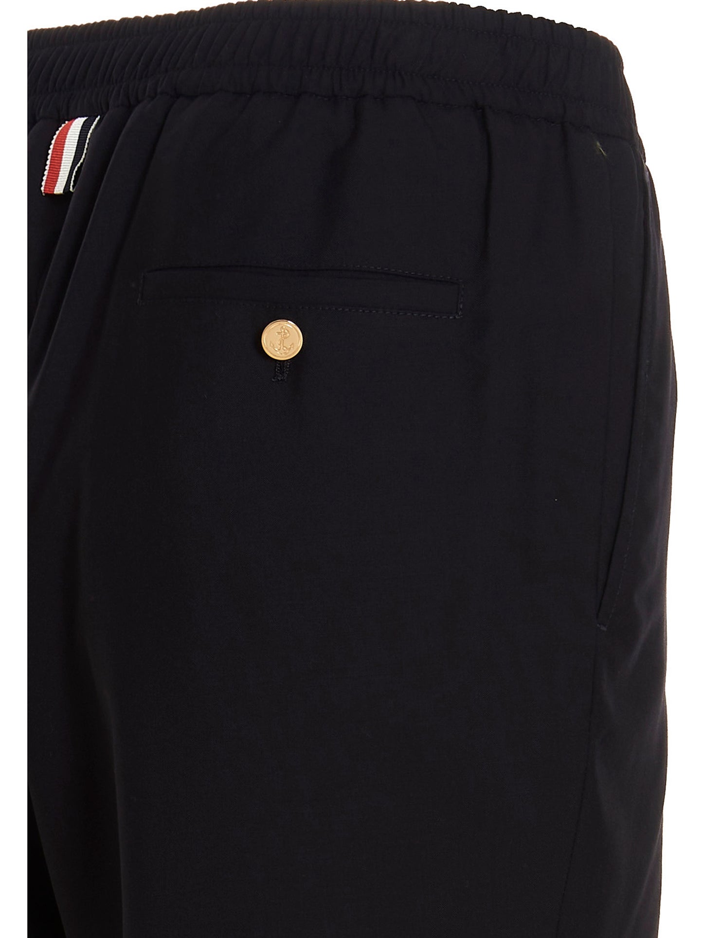 Trousers by Thom Browne for men in wool blue features a tailored silhouette with a tailored athletic, defined by its long and a sophisticated .