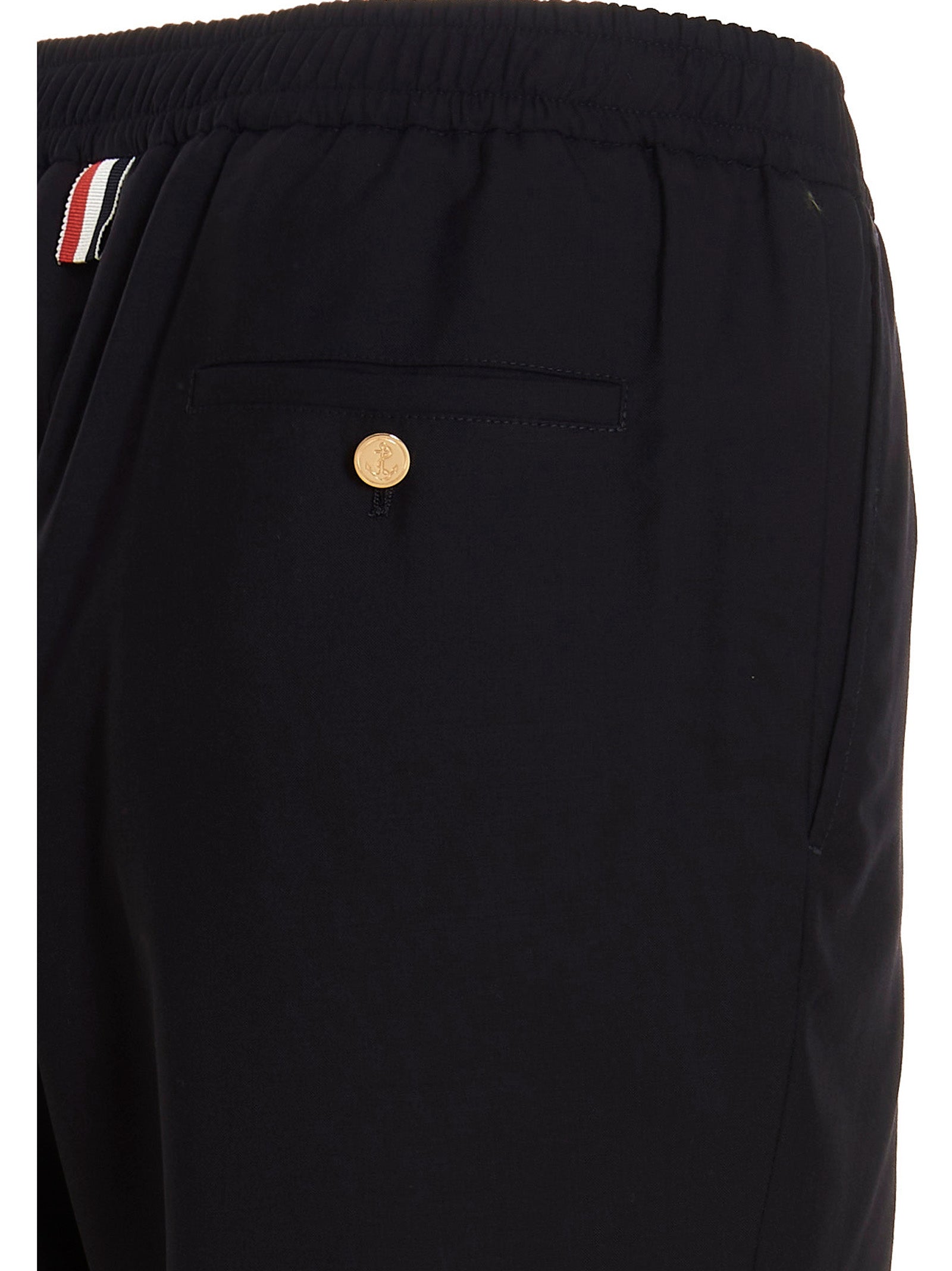 Trousers by Thom Browne for men in wool blue features a tailored silhouette with a tailored athletic, defined by its long and a sophisticated .
