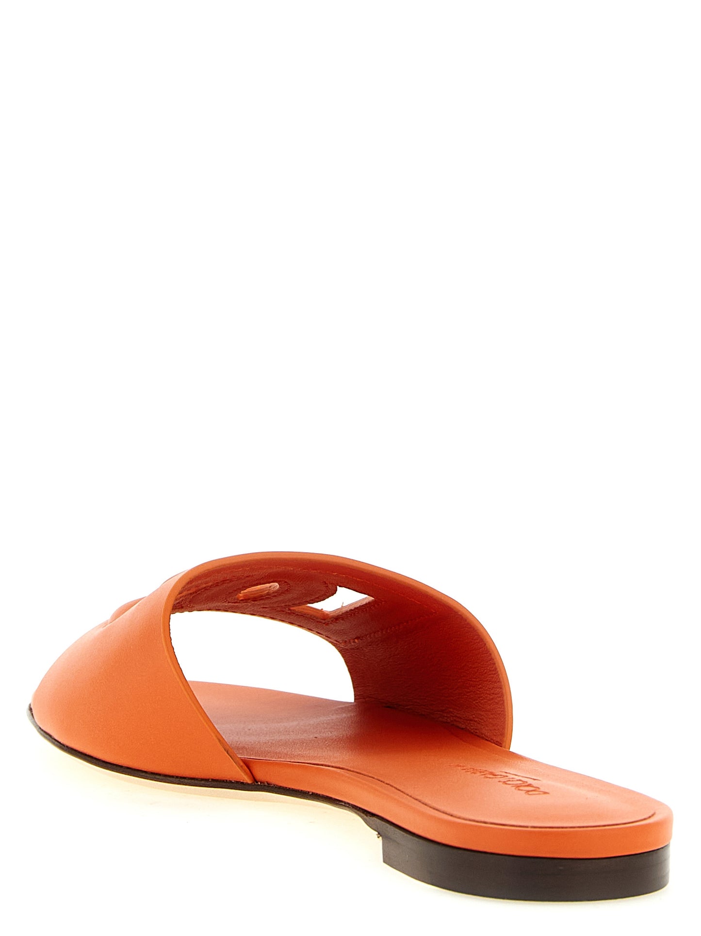 Sliders Flat Shoes by Dolce & Gabbana for women in calfskin leather orange presents a effortless chic silhouette, showcasing the Women's Calfskin Leather Sliders Flat Shoes design with a effortless chic and for a sophisticated look.
